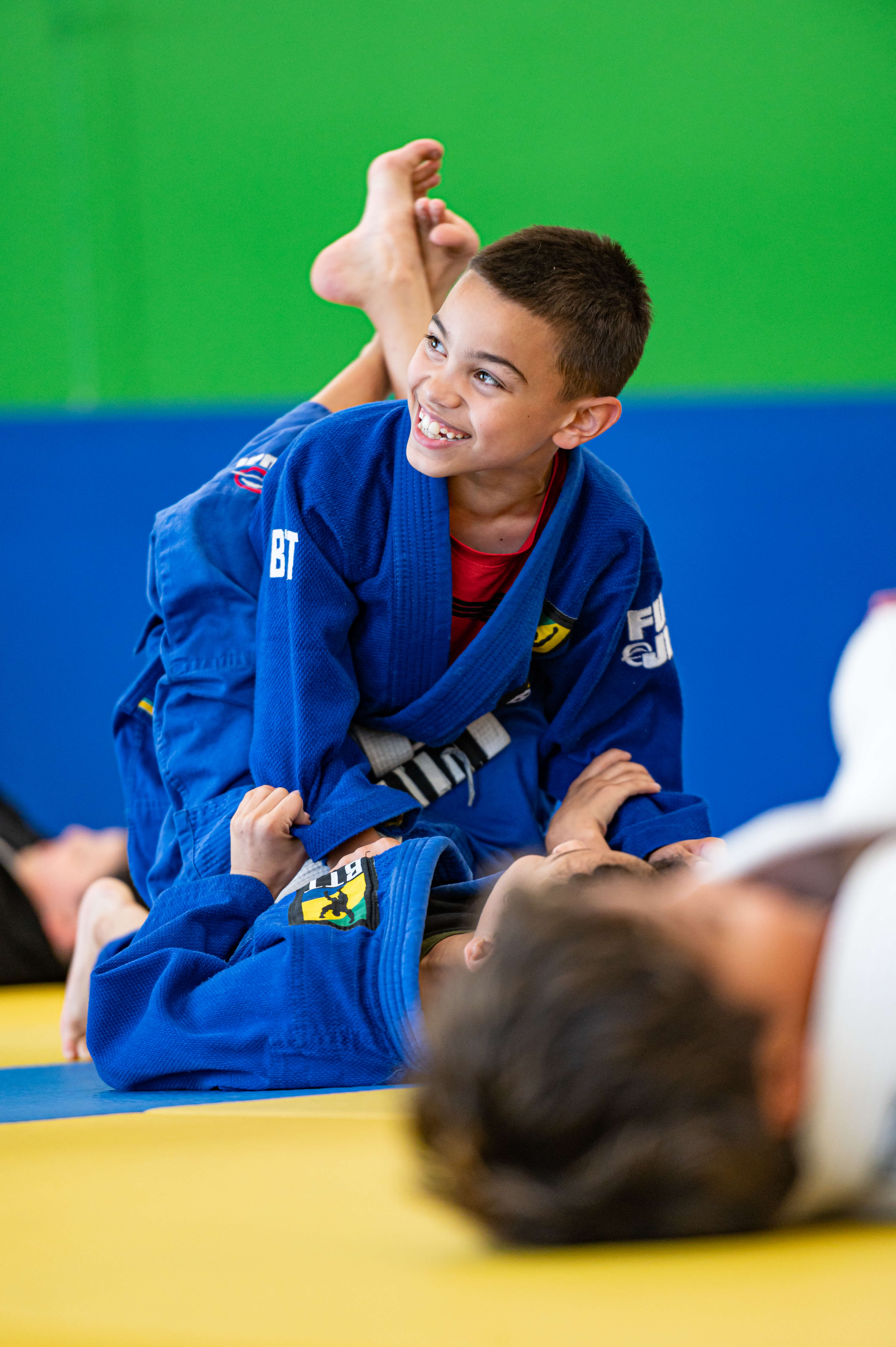Young student smiling during kids Jiu-Jitsu class at BTT North Dallas