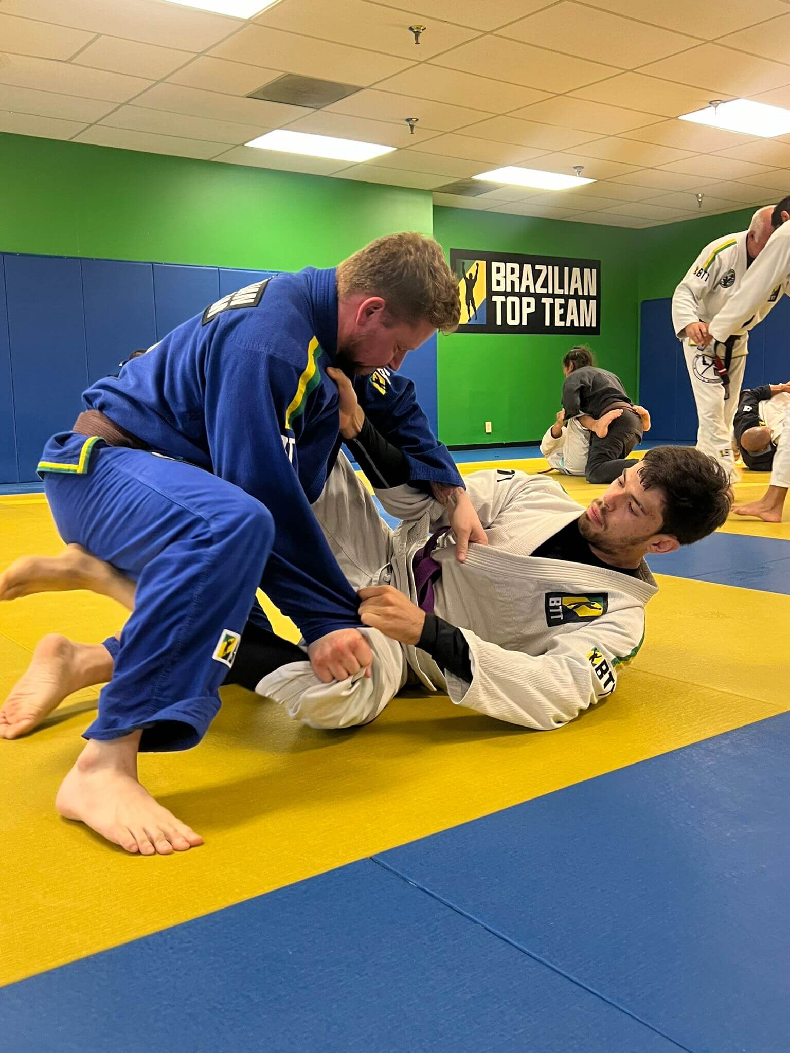 Adult students sparring during Jiu-Jitsu class at BTT North Dallas